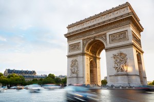 Arc de Triomphe in Paris, France. Traffic in the morning.